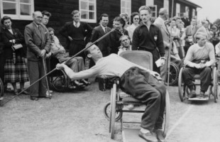 (Original Caption) Joep de Beer of Doorn, Holland, leans into the javelin from his wheelchair during the Stoke Mandeville Games for paraplegic contestants. It was Britain's third international sports festival for men and women paralyzed from the waist down due to spinal injuries. Winners were awarded trophies in the special "Olympics" event.